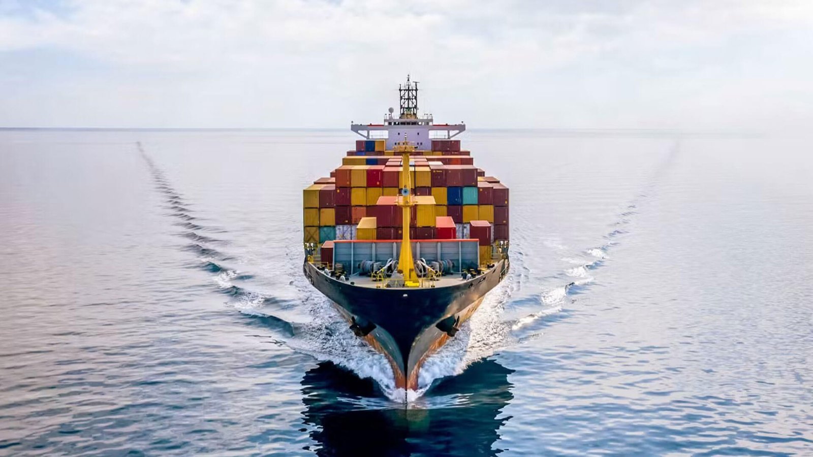 Three people representing a forwarder, carrier, and broker shaking hands