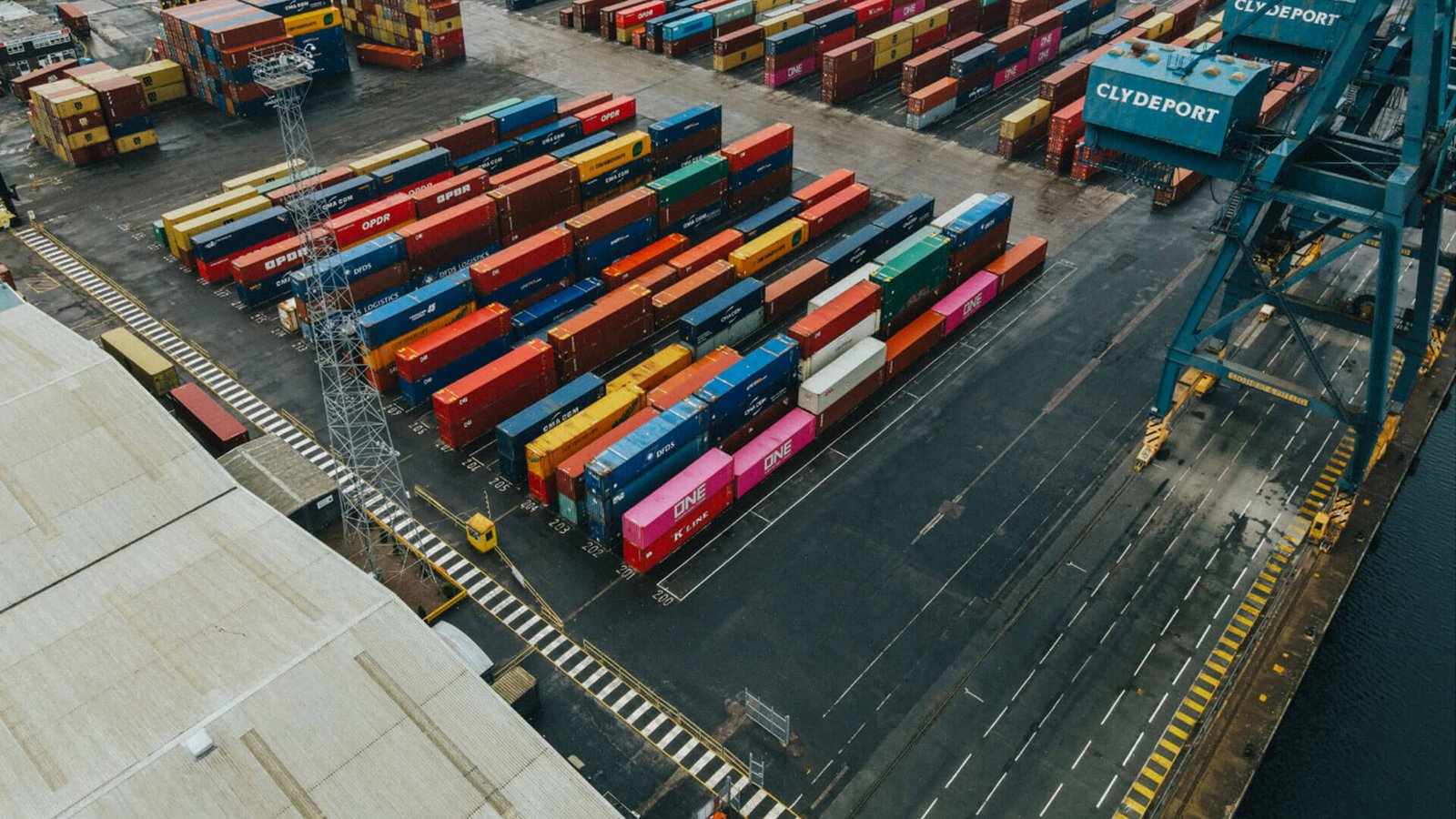 A customs officer reviewing a shipping manifest document